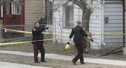 WAYNE GLOWACKI / WINNIPEG FREE PRESS   Winnipeg Police and Fire Paramedics at a house in the 1800 block of Alexander Ave. at Dee St. just before 1pm Thursday afternoon. A male on a stretcher was loaded into an ambulance. Police tape blocked traffic on Alexander Ave.    March 31 2016