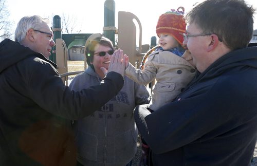WAYNE GLOWACKI / WINNIPEG FREE PRESS    Premier Greg Selinger meets with River,2, and her parents Robin and Scott Potter after he announced support for parents at the NDP campaign event held at Siddall Werrell Park Thursday morning.   Nick Martin story    March 31 2016