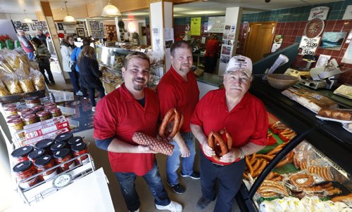 WAYNE GLOWACKI / WINNIPEG FREE PRESS  From right, Walter Klopick and his sons Christian and Zenon at their Tenderloin Meat & Sausage store with samples of some of the approximately 40 products they make.   Murray McNeill story   April 1  2016