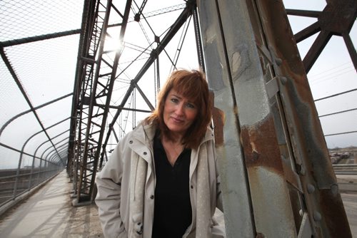RUTH BONNEVILLE / WINNIPEG FREE PRESS  Cece McIntosh wants city council to consider turning the iconic Arlington bridge into a pedestrian and cyclist overpass instead of tearing it down.  Photos of her on the bridge looking southbound and under the bridge next the the tracks.  See Gordon Sinclair story.  April 01, 2016