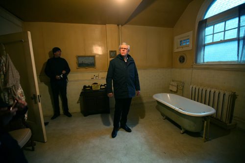 RUTH BONNEVILLE / WINNIPEG FREE PRESS  NDP Leader Greg Selinger looks at a bathroom on a film set in a  heritage home at  6 Ruskin Row  after being given a tour after holding a  press conference announcing new supports for film the industry Friday.       April 01, 2016