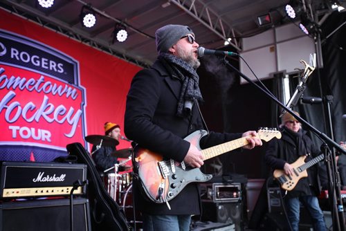 RUTH BONNEVILLE / WINNIPEG FREE PRESS  Pat Wright, guitarist with 'All the Kings Men' sings with his band on stage in the  Forks parking lot during a short rehearsal Saturday morning for Rogers Hometown Hockey Tour that runs Saturday and Sunday.   April 02, 2016