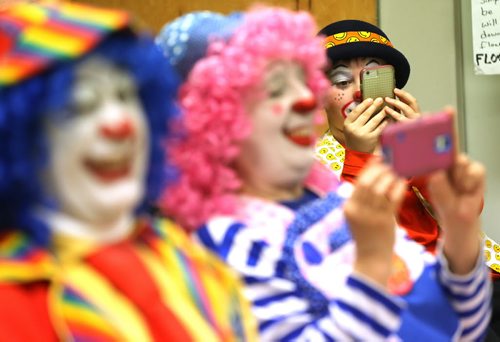 TREVOR HAGAN / WINNIPEG FREE PRESS Left to right, Mr. Squiggly, Puff and Silly, watching fellow clowns during a rehearsal at Crescentwood Community Centre, Thursday, March 31, 2016. The Winnipeg members of the World Clown Association are having a show on April 23rd. 49.8 article for Dave Sanderson.