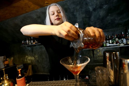 TREVOR HAGAN / WINNIPEG FREE PRESS Elsa Taylor, co-owner and head bartender at The Roost, prepares The Wicked City, Saturday, April 2, 2016. For Bart Kives review.