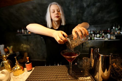 TREVOR HAGAN / WINNIPEG FREE PRESS Elsa Taylor, co-owner and head bartender at The Roost, prepares The Wicked City, Saturday, April 2, 2016. For Bart Kives review.