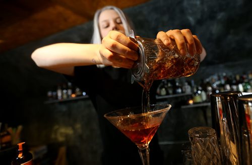 TREVOR HAGAN / WINNIPEG FREE PRESS Elsa Taylor, co-owner and head bartender at The Roost, prepares The Wicked City, Saturday, April 2, 2016. For Bart Kives review.