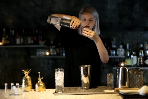 TREVOR HAGAN / WINNIPEG FREE PRESS Elsa Taylor, co-owner and head bartender at The Roost, prepares The Bulletproof, Saturday, April 2, 2016. For Bart Kives review.