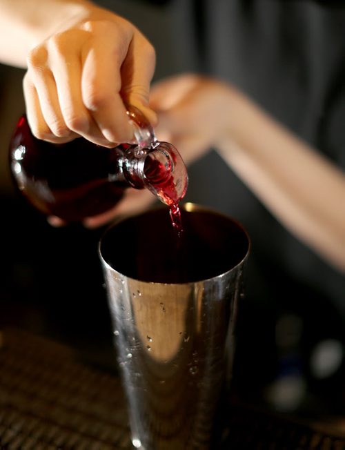 TREVOR HAGAN / WINNIPEG FREE PRESS Elsa Taylor, co-owner and head bartender at The Roost, prepares The Bulletproof, Saturday, April 2, 2016. For Bart Kives review.