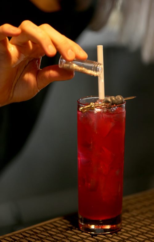 TREVOR HAGAN / WINNIPEG FREE PRESS Elsa Taylor, co-owner and head bartender at The Roost, prepares The Bulletproof, Saturday, April 2, 2016. For Bart Kives review.