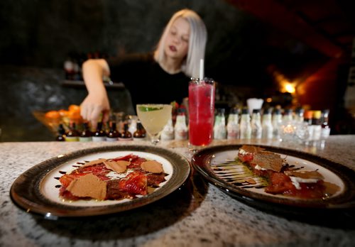 TREVOR HAGAN / WINNIPEG FREE PRESS Beef Carpaccio, left, and Tomato Salad, at The Roost, prepares The Bulletproof, Saturday, April 2, 2016. For Bart Kives review.