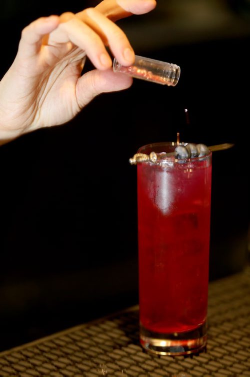 TREVOR HAGAN / WINNIPEG FREE PRESS Elsa Taylor, co-owner and head bartender at The Roost, prepares The Bulletproof, Saturday, April 2, 2016. For Bart Kives review.