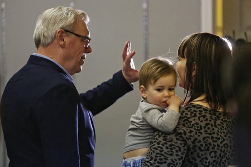 MIKE DEAL / WINNIPEG FREE PRESS  NDP leader Greg Selinger chats with supporter Rachel Berg and her son, Soren, 1, after pledging that if elected his government would create a new $25-million capital fund to build public and community-operated child care centres during a stop at MLA hopeful Deanne Crothers campaign offices on Portage Avenue Sunday morning.   160403 April 03, 2016