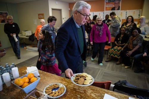 MIKE DEAL / WINNIPEG FREE PRESS NDP leader Greg Selinger hands out cookies after giving a pep talk to a number of volunteers at Christine Melnick's campaign office that were getting ready to go out canvasing Sunday afternoon. 160403 - Sunday, April 03, 2016