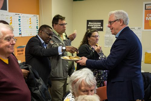 MIKE DEAL / WINNIPEG FREE PRESS NDP leader Greg Selinger hands out cookies after giving a pep talk to a number of volunteers at Christine Melnick's campaign office that were getting ready to go out canvasing Sunday afternoon. 160403 - Sunday, April 03, 2016