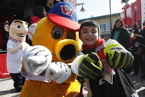 JOHN WOODS / WINNIPEG FREE PRESS Chase Rattana dances with Goldie at the Hometown Hockey event at The Forks Sunday, April 3, 2016.