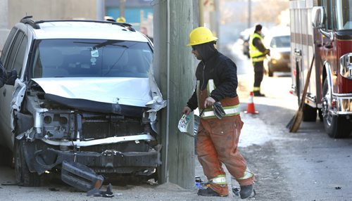 WAYNE GLOWACKI / WINNIPEG FREE PRESS Emergency personnel were out on Higgins Ave. at Waterfront Drive Monday morning  after a vehicle knocked out a traffic light standard and collided with a hydro pole. No one injured in the mishap and Police Cadets were directing traffic.   April 4  2016