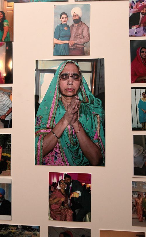 PHIL HOSSACK / WINNIPEG FREE PRESS A devout portrait of Mohinder Singh is framed with family photos in her husband Darshan's study.. Family photo. See Randy Turner Story. - April 4, 2016