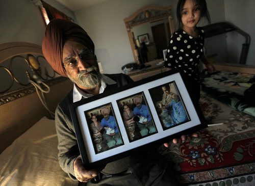 PHIL HOSSACK / WINNIPEG FREE PRESS Darshan Singh shows off portraits of his late wife Mohinder and himself in happier days. Grand-daughter Ariya (3) plays beside him. See Randy Turner Story. - April 4, 2016