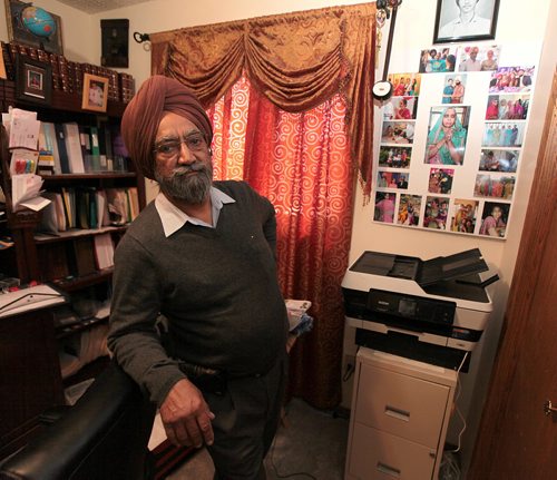 PHIL HOSSACK / WINNIPEG FREE PRESS Darshan Singh shows off portraits of his late wife Mohinder and himself in happier days, a panel of photos hangs in his study. See Randy Turner Story. - April 4, 2016