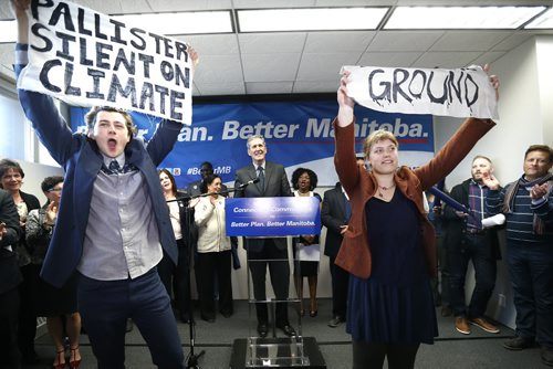 JOHN WOODS / WINNIPEG FREE PRESS Environmentalists Riley McMurray and Natalie Dyck interrupt Manitoba PC leader Brian Pallister as he addresses supporters at a party rally in a Winnipeg hotel Monday, April 4, 2016.