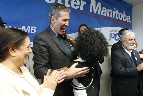 JOHN WOODS / WINNIPEG FREE PRESS Kenny Daodu wipes her lipstick from Brian Pallister's lips after she kissed the Manitoba PC leader at a party rally in a Winnipeg hotel Monday, April 4, 2016.