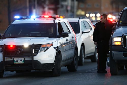 JOHN WOODS / WINNIPEG FREE PRESS Police attend to an incident on Pembina at McGillivray Blvd Monday, April 4, 2016.