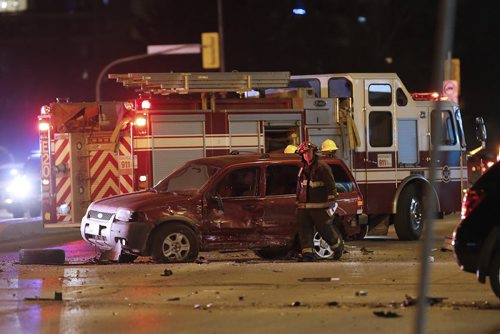 JOHN WOODS / WINNIPEG FREE PRESS Police and emergency personnel attend a multi-car MVC on Portage at Woodlands Monday, April 4, 2016.