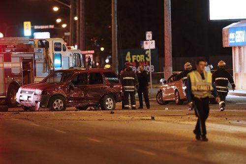 JOHN WOODS / WINNIPEG FREE PRESS Police and emergency personnel attend a multi-car MVC on Portage at Woodlands Monday, April 4, 2016.