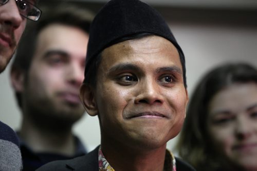 RUTH BONNEVILLE / WINNIPEG FREE PRESS  Malaysian student Hazim Ismail is overwhelmed with joy as he is hugged by friends and supporters  outside the refugee hearing office in Winnipeg Tuesday morning after winning his case against being deported back to Malaysia where he had been given death threats due to his sexual orientation.   See Carol Sanders story.      April 05, 2016