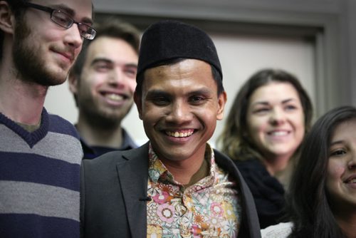 RUTH BONNEVILLE / WINNIPEG FREE PRESS  Malaysian student Hazim Ismail is overwhelmed with joy as he is hugged by friends and supporters  outside the refugee hearing office in Winnipeg Tuesday morning after winning his case against being deported back to Malaysia where he had been given death threats due to his sexual orientation.   See Carol Sanders story.      April 05, 2016