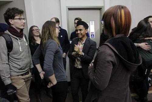 RUTH BONNEVILLE / WINNIPEG FREE PRESS  Malaysian student Hazim Ismail is overwhelmed with joy as he is congratulated by friends and supporters  outside the refugee hearing office in Winnipeg Tuesday morning after winning his case against being deported back to Malaysia where he had been given death threats due to his sexual orientation.   See Carol Sanders story.      April 05, 2016