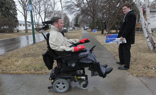 RUTH BONNEVILLE / WINNIPEG FREE PRESS  Tory candidate Steven Fletcher makes his way along Stewart Street in the Assiniboia riding door-knocking with PC volunteers Tuesday.     April 05, 2016