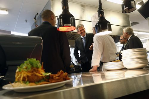 WAYNE GLOWACKI / WINNIPEG FREE PRESS  Progressive Conservative Leader Brian Pallister, centre, tours the kitchen in the Red River College's  School of Hospitality and Culinary Arts on his tour of the downtown campus Tuesday.   For  Bart Kives behind the scenes story  April 5  2016