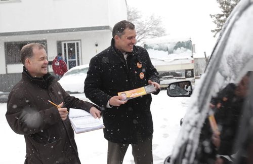 RUTH BONNEVILLE / WINNIPEG FREE PRESS  NDP candidate Joe McKellep talks to residents on Lake Ridge Road with Jim Rondeau (left) working with him in Assiniboia Tuesday.      April 05, 2016