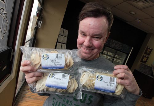 PHIL HOSSACK / WINNIPEG FREE PRESS Perogy Planet's Rob Naleway shows off a few samples of the businesses unique perogy, stuffed with "Ruben", Chorzio Sausage and Sweet potatoe and brie Dave Sanderson story. - April 5, 2016