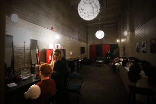 JOHN WOODS / WINNIPEG FREE PRESS Aiden Moore, bass player, gets a fine tuning on his wig by stylist Mazena Puksto backstage to hitting the stage in A Night With Janis Joplin in Winnipeg Tuesday, April 5, 2016.