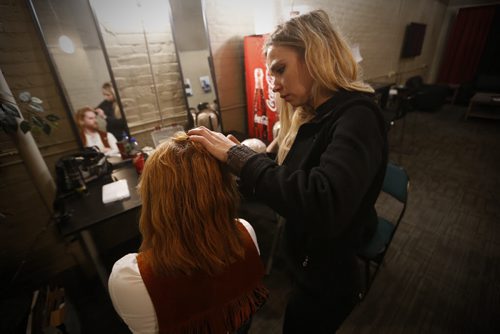 JOHN WOODS / WINNIPEG FREE PRESS Aiden Moore, bass player, gets a fine tuning on his wig by stylist Mazena Puksto backstage to hitting the stage in A Night With Janis Joplin in Winnipeg Tuesday, April 5, 2016.