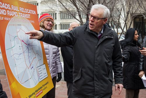 MIKE DEAL / WINNIPEG FREE PRESS NDP leader Greg Selinger outlined a plan to create an inner ring road, move rail lines and share costs 50/50 with federal government during a campaign announcement outside City Hall Wednesday morning. 160406 - Wednesday, April 06, 2016