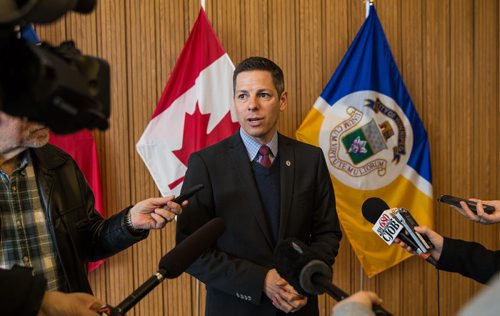 MIKE DEAL / WINNIPEG FREE PRESS Winnipeg Mayor Brian Bowman reacts to the announcement by NDP leader Greg Selinger who outlined a plan to create an inner ring road, move rail lines and share costs 50/50 with the federal government outside his office at City Hall Wednesday morning. 160406 - Wednesday, April 06, 2016