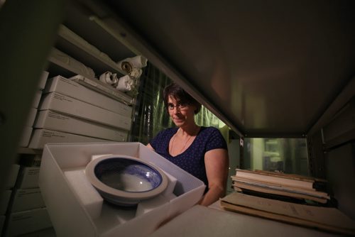 RUTH BONNEVILLE / WINNIPEG FREE PRESS  Andrea Reichert, curator of the Manitoba Crafts Museum and Library on Kennedy holds a bowl created by Janice Howorth that is just one of the hundreds of items being packed up and moved to a new location near the Exchange District.   See Alan Small's story.    April 06, 2016