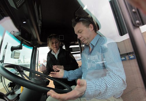 PHIL HOSSACK / WINNIPEG FREE PRESS Geoff Kirbyson climbs into the drivers seat of a city transit bus Wednesday, while Transit's Driving Instructor Denise Aston-Devisscher looks on. See his story. April  6, 2016