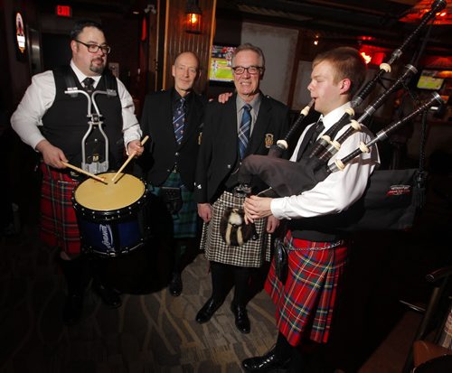 BORIS MINKEVICH / WINNIPEG FREE PRESS Manitoba Tartan Day 2016 at Tavern United Pub downtown. Left to right: Police Pipe band drummer Craig Weston, President of the Scottish Heritage Council of Manitoba John Perrin, HCol Barry Burns, and Police Pipe Band drummer Stephen Moyer. The event had a gathering of tartan wearing people. Between 30-40 attended in total. Most not wearing tartans. April 6, 2016