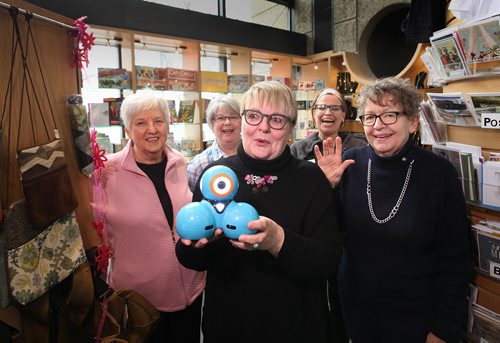 RUTH BONNEVILLE / WINNIPEG FREE PRESS  Philanthropy page with Friends of the Winnipeg Library volunteers inside the doors of their gift shop at the Millennium library.   From left - Heather Graham (pink), Kathy Blight (blue plaid)  Amy Minaker (youngest), Billie Stewart (right) and Janice Chance (front and centre).   April 07, 2016