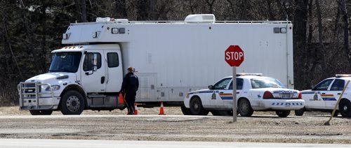WAYNE GLOWACKI / WINNIPEG FREE PRESS  After a suspect was arrested, an RCMP truck passes through the Police road block on a road the leads into the Dakota Tipi First Nation Thursday after early morning shooting. Bill Redekop story   April 7  2016