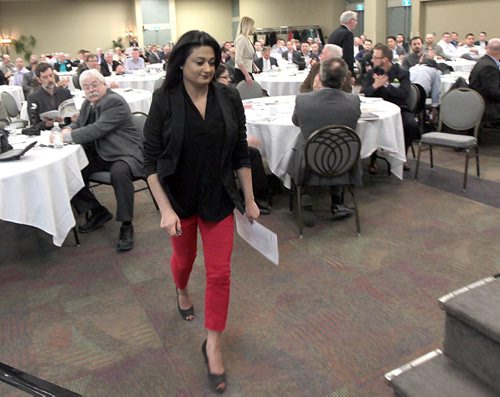 PHIL HOSSACK / WINNIPEG FREE PRESS Rana Bokhari (left) moves to the podium to adress to the Manitoba Trucking Association Friday at the convention centre. See story.  APRIL 8, 2016