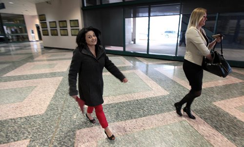 PHIL HOSSACK / WINNIPEG FREE PRESS Rana Bokhari (left) leaves after speaking to the Manitoba Trucking Association Friday at the convention centre, on her way to Kelvin High School for another event. See story.  APRIL 8, 2016