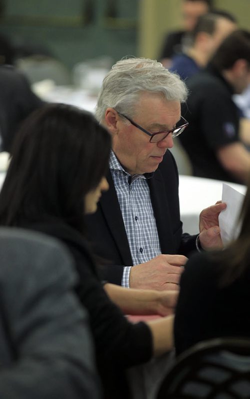 PHIL HOSSACK / WINNIPEG FREE PRESS Greg Selinger preps before speaking to the Manitoba Trucking Association Friday at the convention centre. (Liberal leader Rana Bokhari sits to his left) See story.  APRIL 8, 2016