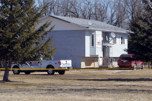 BORIS MINKEVICH / WINNIPEG FREE PRESS DAKOTA TIPI FIRST NATION, MB - RCMP are still at locations on the reserve where double shooting occurred early Thursday morning. RCMP police tape around Tyson Pashe house. Blue house closest to the cemetery. April 8, 2016