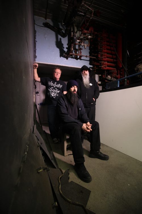RUTH BONNEVILLE / WINNIPEG FREE PRESS  Members of a local heavy metal band called Immortal Possession, pose for a group photo in warehouse.   Names of members; Chuck Lebossiere (centre, black beard), Rob Shallcross (white beard) and John Duke.      April 08, 2016