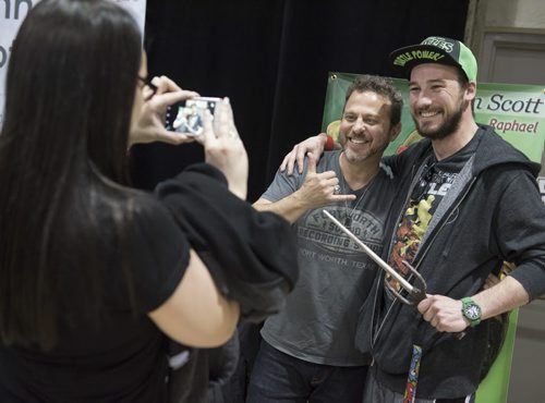 DAVID LIPNOWSKI / WINNIPEG FREE PRESS   Actor Kenn Scott who played Raphael in the Teenage Mutant Ninja Turtles poses for a photo with Alex McCormack as his girlfriend Jenny Newman snaps the shot at the Winnipeg Pop Culture Expo at the Convention Centre Saturday April 9, 2016.